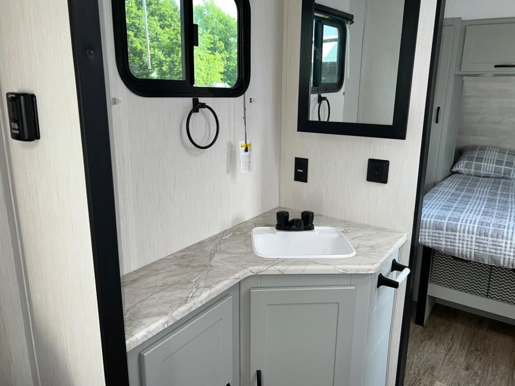 Vibe 28BHE has a walk through middle bath for added bathroom space